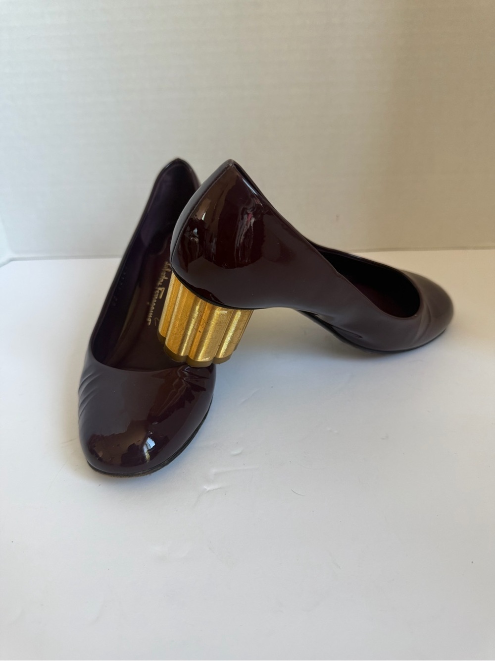 Salvatore Ferragamo Burgundy Patent Pumps with Gold Sculpted Heel